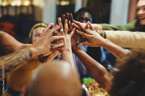 High-five at a diverse dinner party