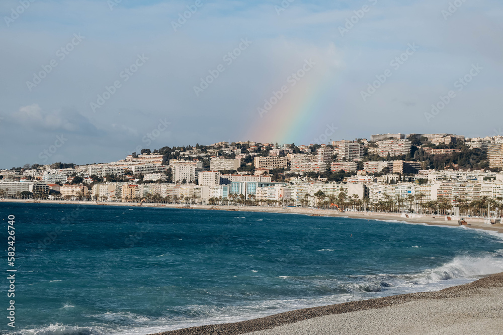 Nice, France - 17.03.2023: View of Nice and the Bay of Angels, with a rainbow over the city
