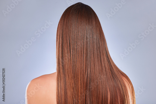Hair, model and back of a woman with beauty, wellness and soft hairstyle texture in a studio. Cosmetics, shampoo treatment and keratin of a female with healthy, clean and haircare shine from salon