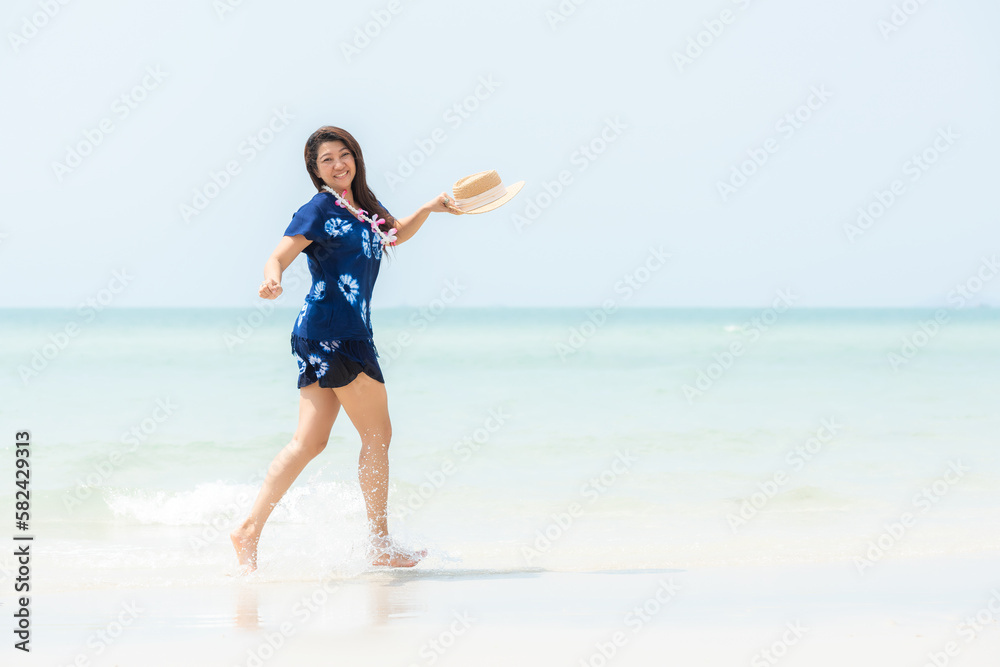 Summer vacations. Lifestyle woman relax and chill on beach background. Asia happy young people jumping on the wave sea, summer trips walking enjoy tropical beach. Lifestyle and Travel Concept Summer vacations. Lifestyle woman relax and chill on beach background. Asia happy young people jumping on the wave sea, summer trips walking enjoy tropical beach. Lifestyle and Travel Concept