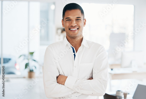 Portrait, face or happy businessman in office for financial accounting or audit in corporate company. Smiling worker, proud or successful Indian manager with leadership, smile and positive mindset