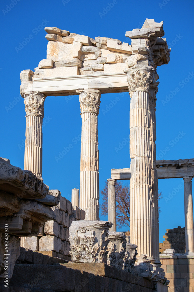 Vertical photo of ruins of the Temple of Trajan on a background of blue sky. Bergama, Turkey.