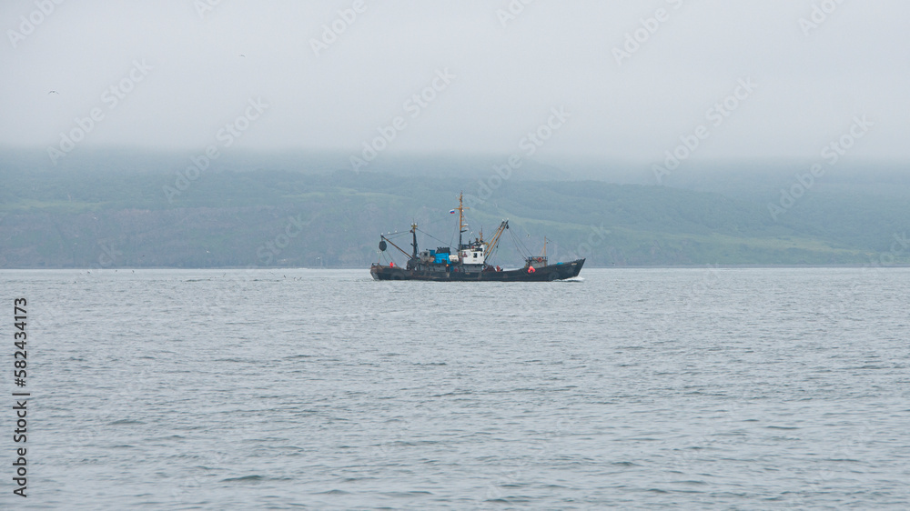 Fishing boat in Avacha Bay in Kamchatka peninsula