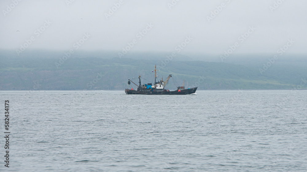Fishing boat in Avacha Bay in Kamchatka peninsula Fishing boat in Avacha Bay in Kamchatka peninsula