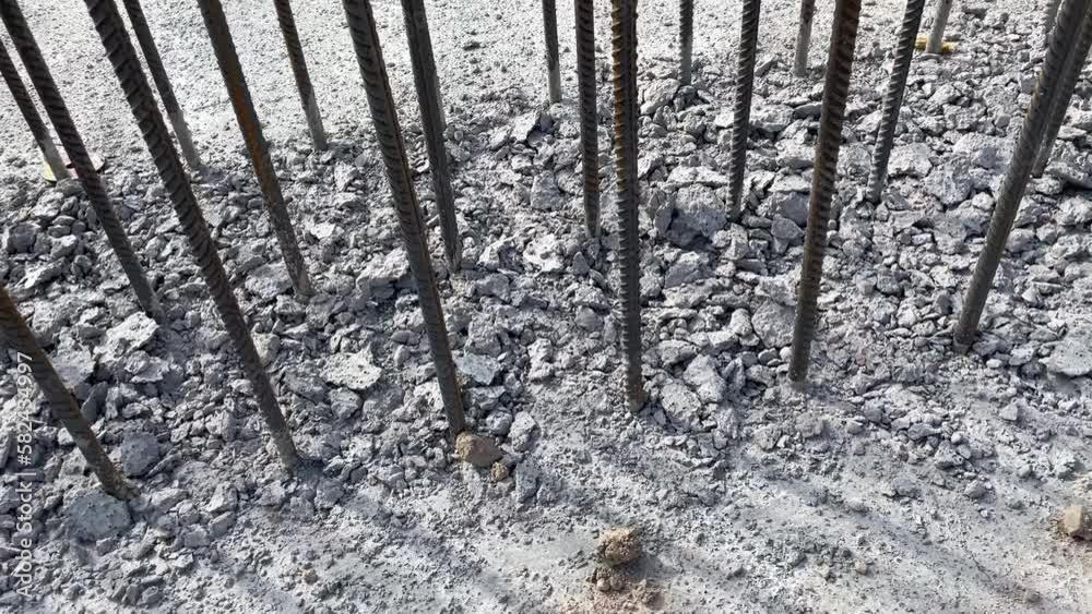 Chipping concrete surface. Rebar for concrete pouring. Steel reinforcement bars. Construction