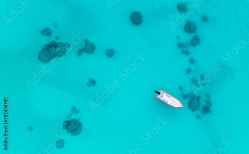 fishing in hawaii with blue water and coral. © jdross75
