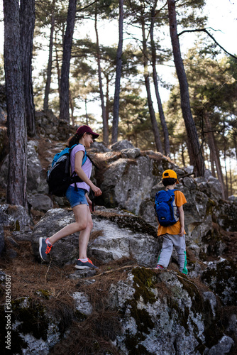 Family lifestyle, mother and son, child outdoors on a hike, travel, vacation together with the child.