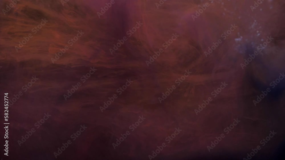 Slow motion orange and pink ink acrylic mixing in water, swirling softly underwater. Acrylic cloud paint in aquarium. Abstract smoke explosion animation. Air bubbles floating under transparent water Slow motion orange and pink ink acrylic mixing in water, swirling softly underwater. Acrylic cloud paint in aquarium. Abstract smoke explosion animation. Air bubbles floating under transparent water