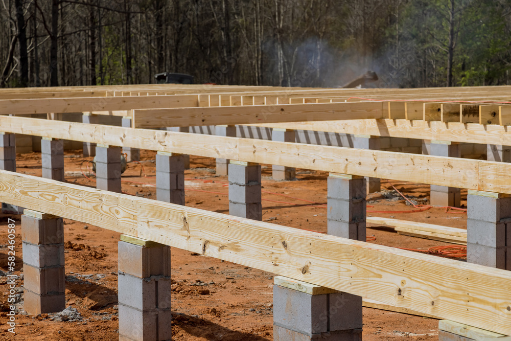 Layout of wood floor joists on concrete block foundation for new house