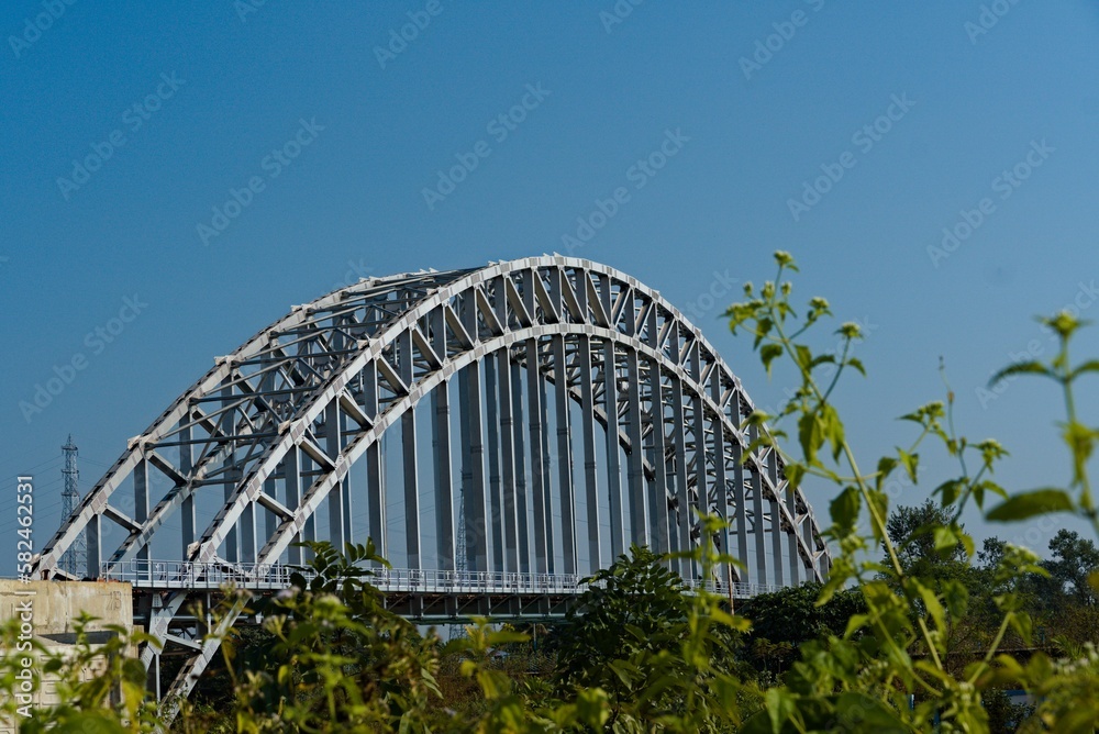 arch shaped road bridge over the river canal