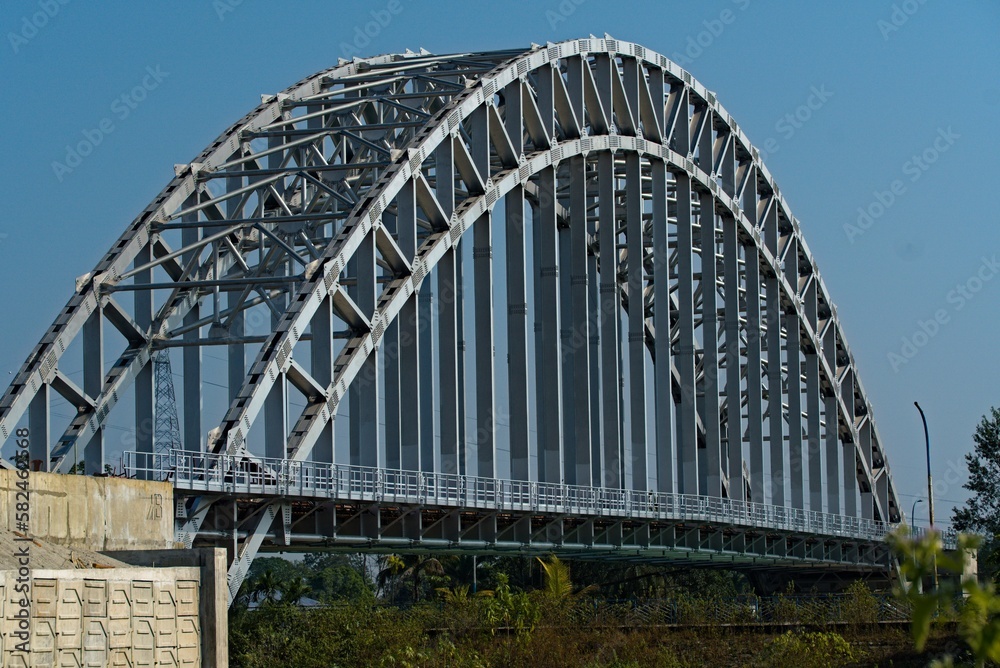 arch shaped road bridge over the river canal