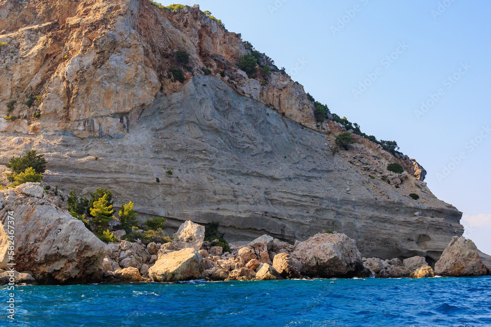 View of the rocky shore from the sea. Mediterranean Sea in Turkey. Popular tourist places. Background