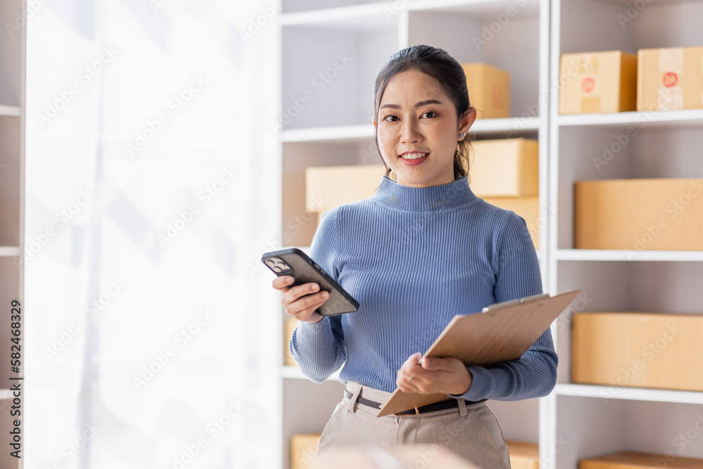 Startup small business entrepreneur SME, asian woman receive order on phone. Success young Asian small business owner home office, online sell marketing delivery, SME e-commerce telemarketing concept Startup small business entrepreneur SME, asian woman receive order on phone. Success young Asian small business owner home office, online sell marketing delivery, SME e-commerce telemarketing concept