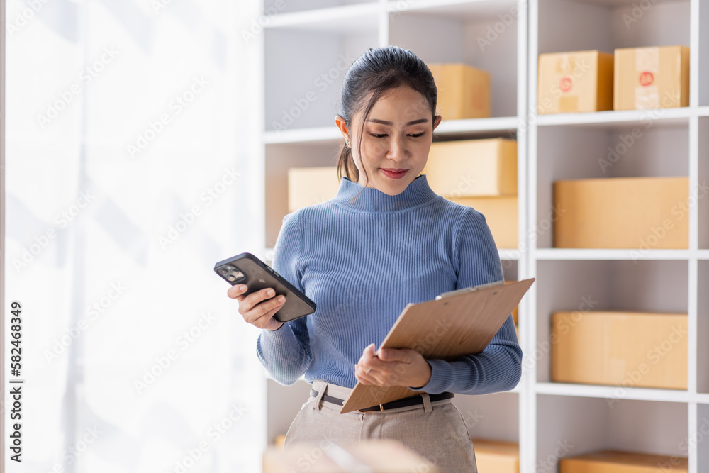 Startup small business entrepreneur SME, asian woman receive order on phone. Success young Asian small business owner home office, online sell marketing delivery, SME e-commerce telemarketing concept Startup small business entrepreneur SME, asian woman receive order on phone. Success young Asian small business owner home office, online sell marketing delivery, SME e-commerce telemarketing concept