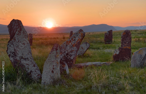 View of the ancient burial mounds and menhirs in the steppes and mountains of Khakassia, Russia.