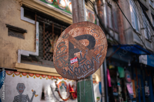 Old rusty no parking sign in Patan Durbar Square, Nepal