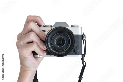 Hand holding vintage camera shooting front view isolated on transparent background