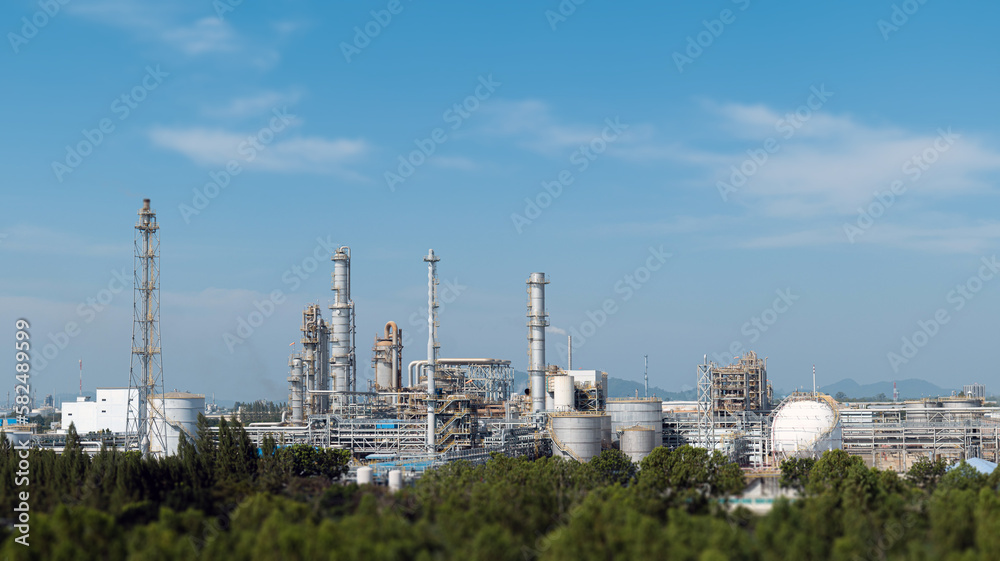 The landscape of an industrial and chemical plant during the daytime showcases a large engineering structure and modern technology construction work. Highlights development in the industrial chemical