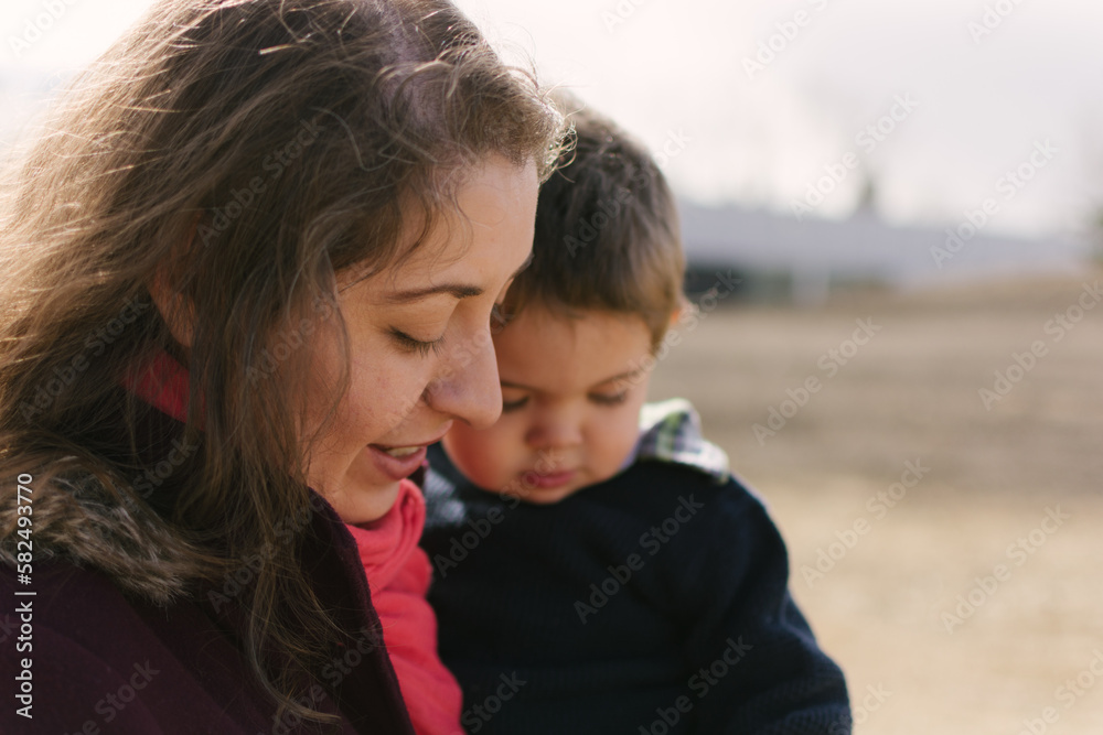 Portrait of a mother and her son walking in a park Portrait of a mother and her son walking in a park