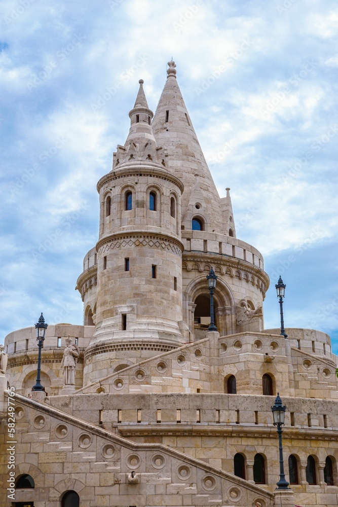 Vertical low-angle shot of the tower of Fisherman's bastion in Budapest, Hungary