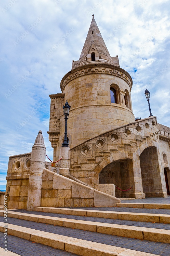 Vertical low-angle shot of the tower of Fisherman's bastion in Budapest, Hungary