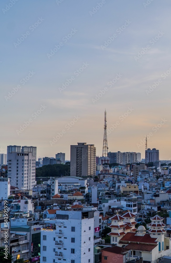 Fototapeta premium Amazing vertical sunset view of District 1 of Saigon in Ho Chi Minh City, Vietnam
