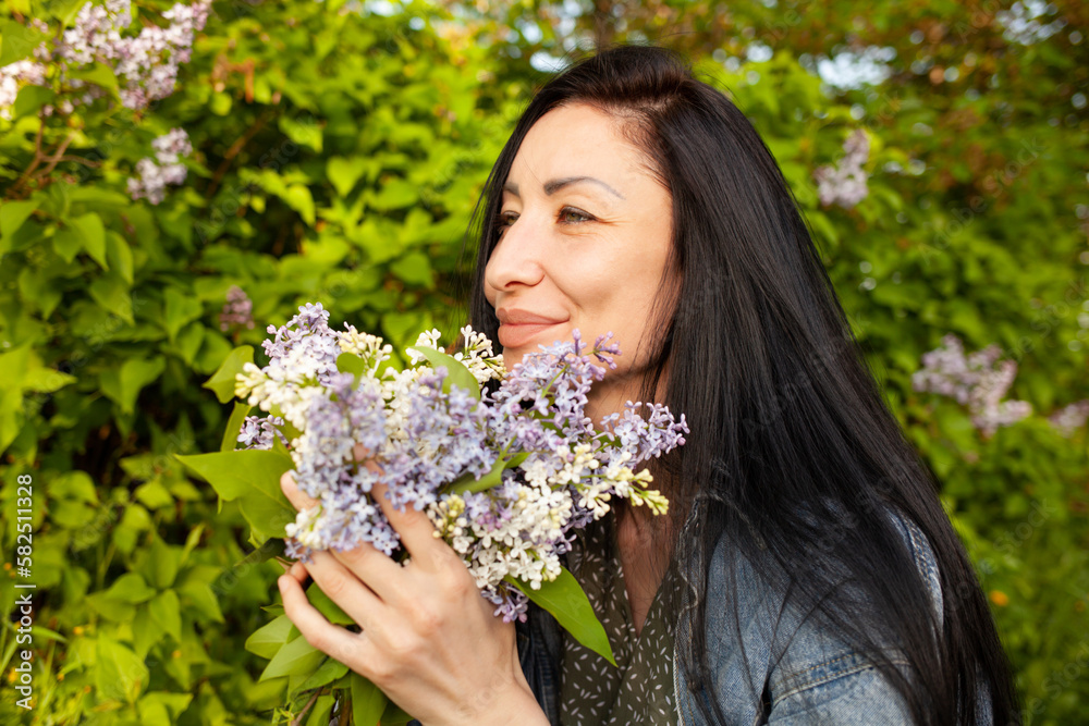 Facial close-up portrait of youthful female posing against green trees, smiling widely, feeling free, enjoying hot summer day. Facial close-up portrait of youthful female posing against green trees, smiling widely, feeling free, enjoying hot summer day.
