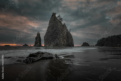 Cliffs at Rialto Beach on a cloudy day. Olympic National Park, Washington State, USA.