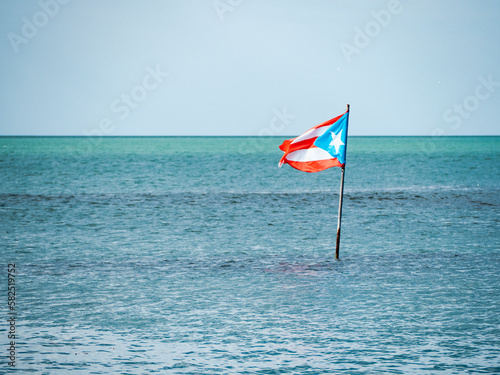 Bilde på lerret Puerto Rican flag in the middle of the ocean