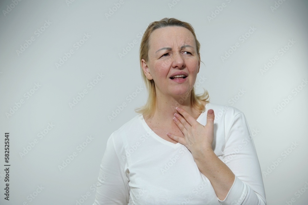 real people sore throat nausea woman holding hand on throat opening her mouth with unpleasant expression wrinkled her eyebrows and slightly closing eyes no hairstyle tired sick person real people sore throat nausea woman holding hand on throat opening her mouth with unpleasant expression wrinkled her eyebrows and slightly closing eyes no hairstyle tired sick person