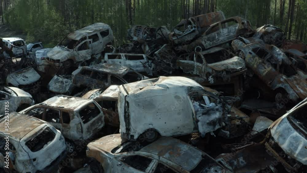 Destroyed cars. The war in Ukraine with Russia. Results of aerial bombing. The cemetery of cars. An act of terrorism. Bucha, Irpen, Kherson, Bakhmut, Solidar. Shots and footage from the sky. Quadcopte Destroyed cars. The war in Ukraine with Russia. Results of aerial bombing. The cemetery of cars. An act of terrorism. Bucha, Irpen, Kherson, Bakhmut, Solidar. Shots and footage from the sky. Quadcopte