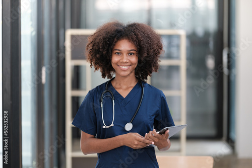 Portrait of female African American doctor with Stethoscope in her office at clinic.