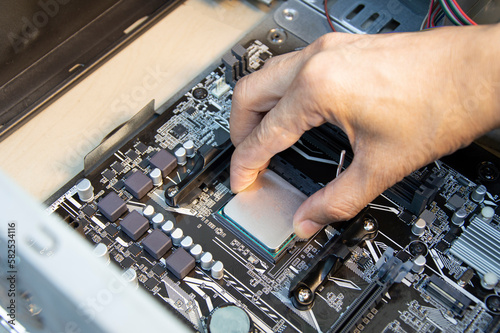 top view technician inserting cpu, computer assembler