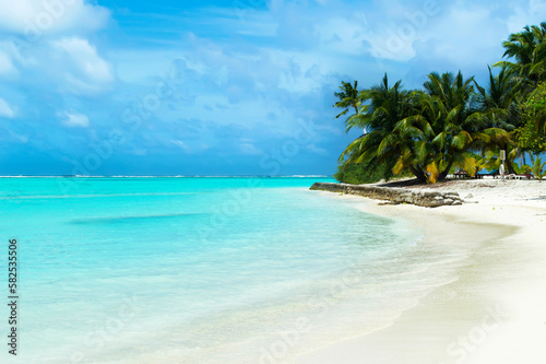Fototapeta Naklejka Na Ścianę i Meble -  A deserted sandy beach on the Indian Ocean. Cloudy day in the Maldives