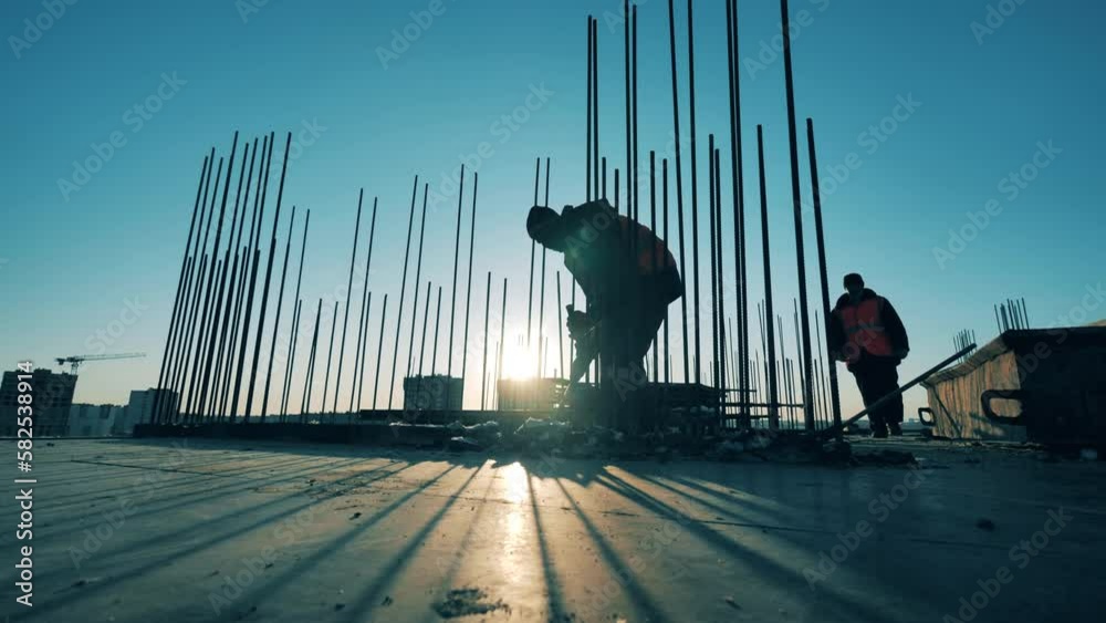 Industrial worker is demolishing concrete on the construction site