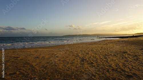 Composition of coastal sunset, featuring vivid indigo, blue, and purple colors. 