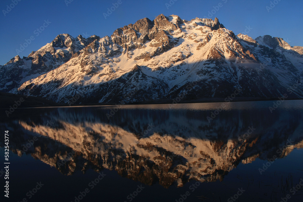 The beautiful Pontet Lake in the french Alps with view on La Meije mountain The beautiful Pontet Lake in the french Alps with view on La Meije mountain