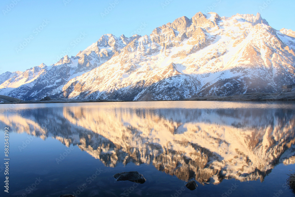 The beautiful Pontet Lake in the french Alps with view on La Meije mountain The beautiful Pontet Lake in the french Alps with view on La Meije mountain