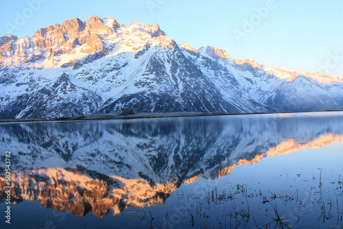 The beautiful Pontet Lake in the french Alps with view on La Meije mountain