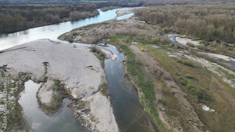 water emergency and drought due to lack of rain due to global warming and the decrease of glaciers - Drone aerial view of dry river with scarcity of water in Lombardy Pavia - Ticino di Besate water emergency and drought due to lack of rain due to global warming and the decrease of glaciers - Drone aerial view of dry river with scarcity of water in Lombardy Pavia - Ticino di Besate