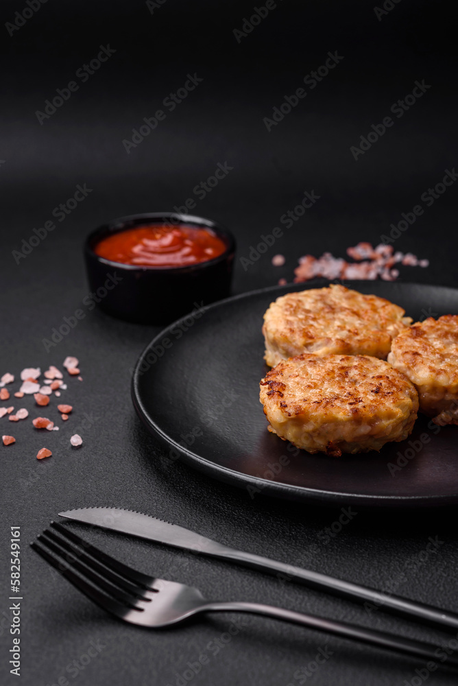 Delicious fresh cutlets or meatballs with spices, herbs and tomato sauce Delicious fresh cutlets or meatballs with spices, herbs and tomato sauce