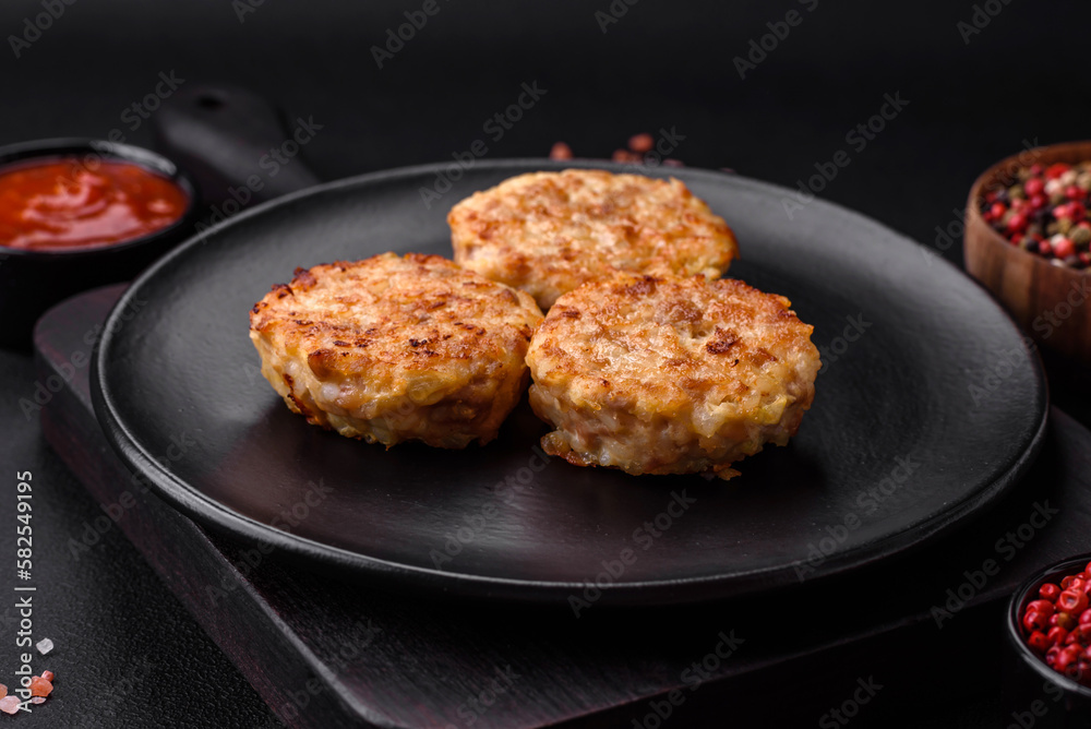 Delicious fresh cutlets or meatballs with spices, herbs and tomato sauce Delicious fresh cutlets or meatballs with spices, herbs and tomato sauce