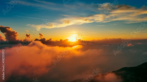 Flying in bright sunset clouds © Kokhanchikov