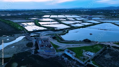 Landscape at sunset. Aerial view from a drone of the landscape of marshes and salt flats of the Ria Formosa Natural Park. Atlantic Ocean. Algarve. Portugal. Europe