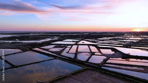Landscape at sunset. Aerial view from a drone of the landscape of marshes and salt flats of the Ria Formosa Natural Park. Atlantic Ocean. Algarve. Portugal. Europe