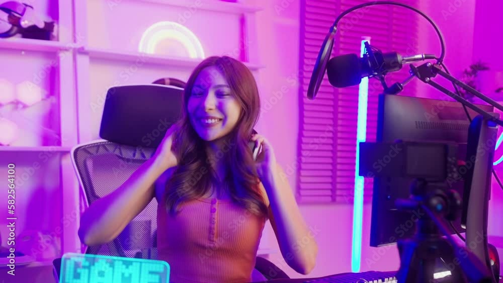 Young Asian Pretty woman Pro Gamer have live streaming , singing and chatting with her fans at home Young Asian Pretty woman Pro Gamer have live streaming , singing and chatting with her fans at home