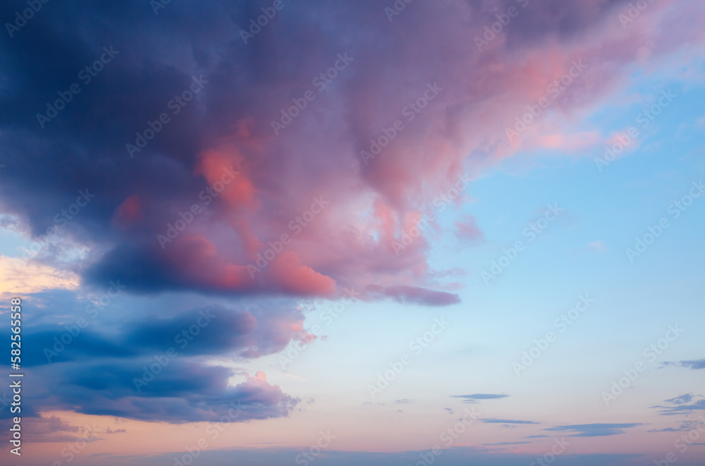 Overcast sky with pink clouds after sunset.