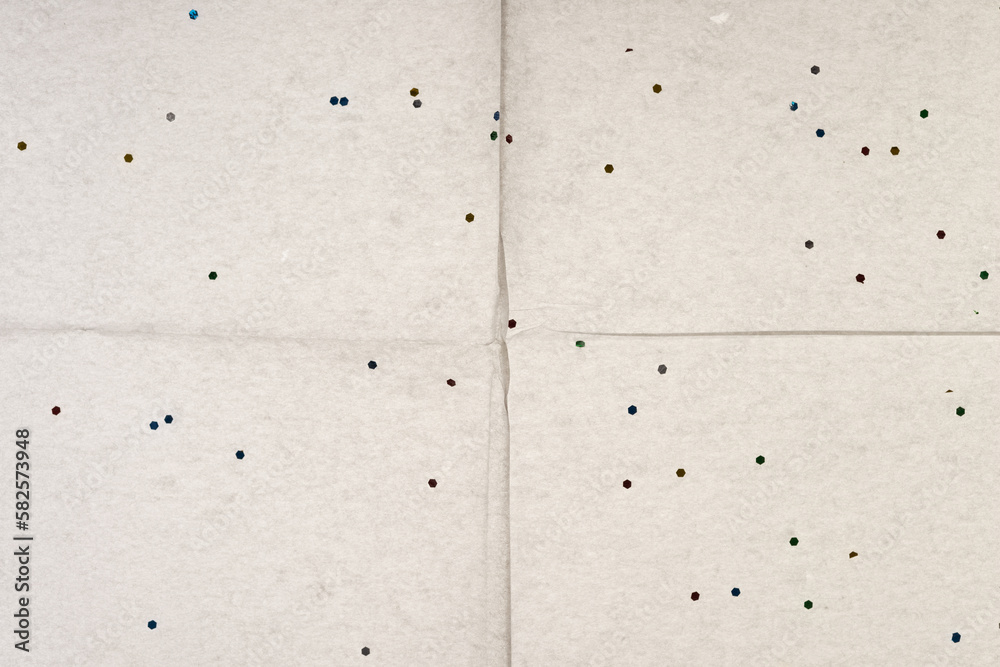 backlit tissue paper with glitter spots background