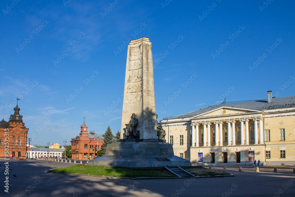 VLADIMIR, RUSSIA - AUGUST, 17, 2022: Cathedral Square in the old town with a stele with bronze statues on a sunny summer day and copy space