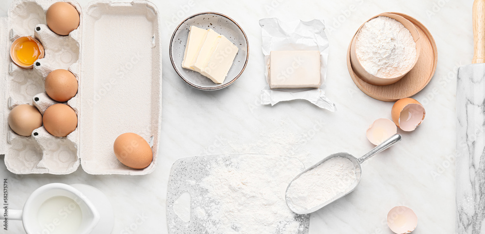 Ingredients for dough on white background, top view Ingredients for dough on white background, top view
